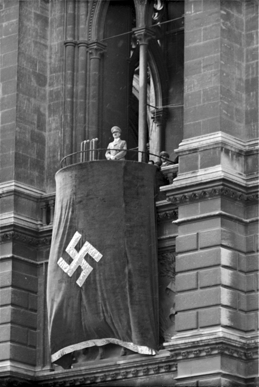 Adolf Hitler makes a speech from the balcony of Vienna's Rathaus
